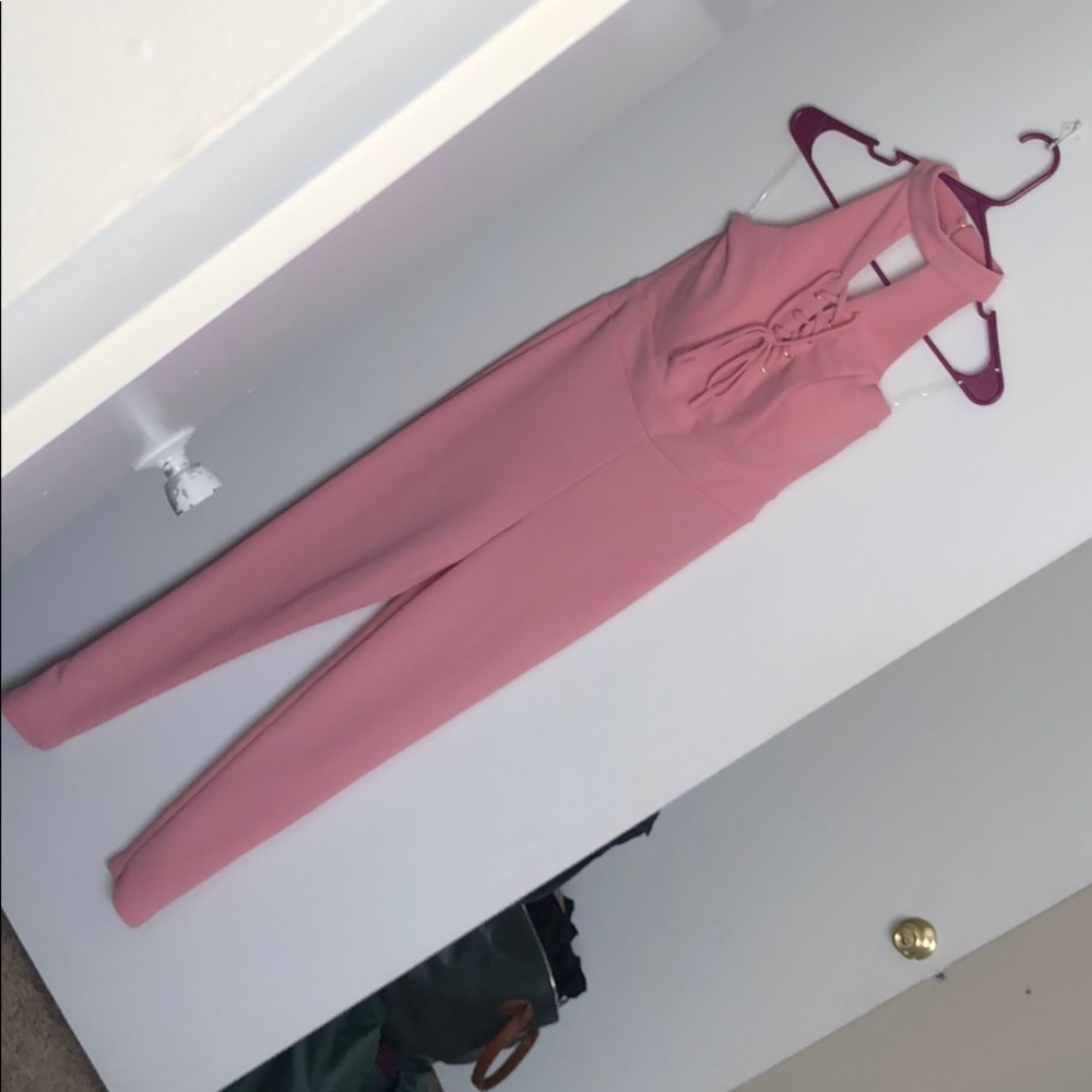 Pink skinny leg romper, with lace up front